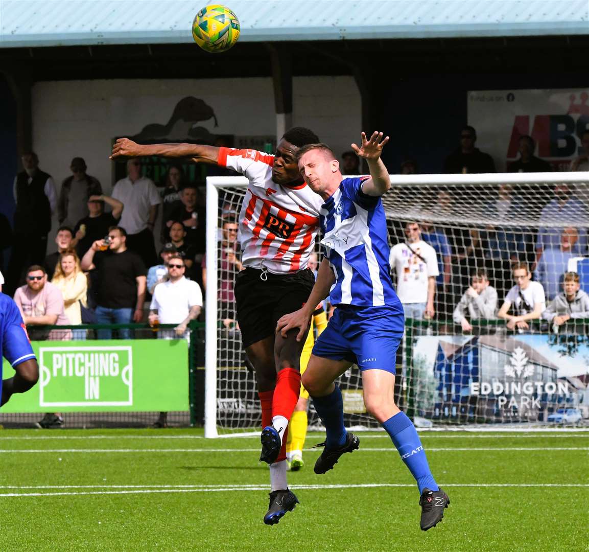 Herne Bay's Kane Rowland challenges in the air. Picture: Marc Richards